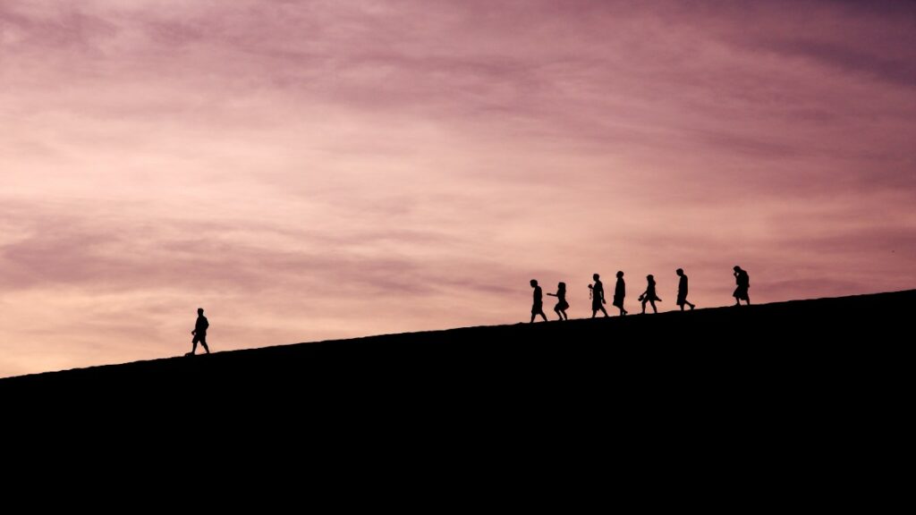 People walking on a hill being led by an API strategy