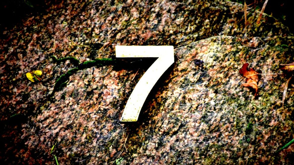 The number seven on gravel representing seven recent API trends.