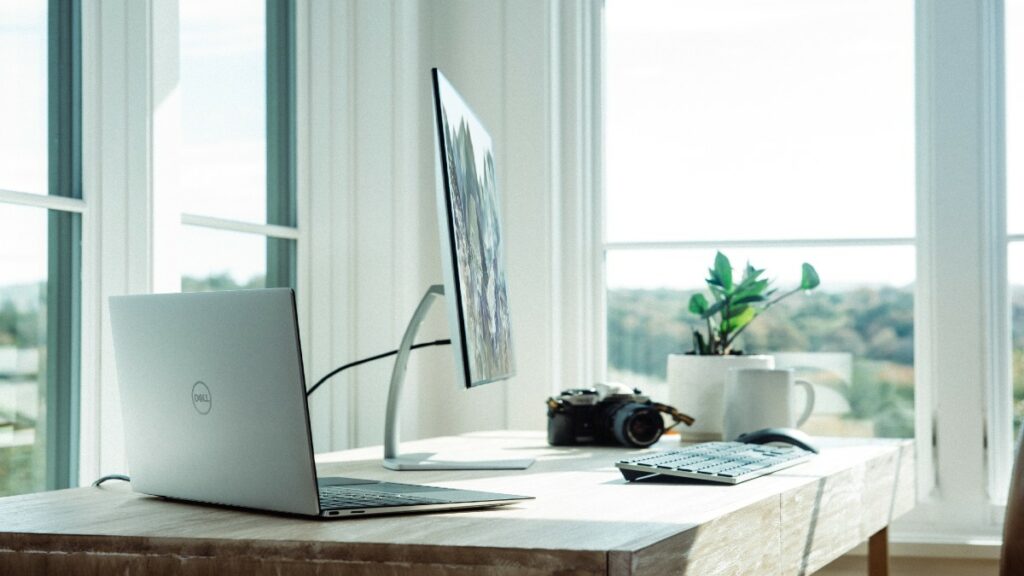 Laptop and monitor on desk to modernize business technology
